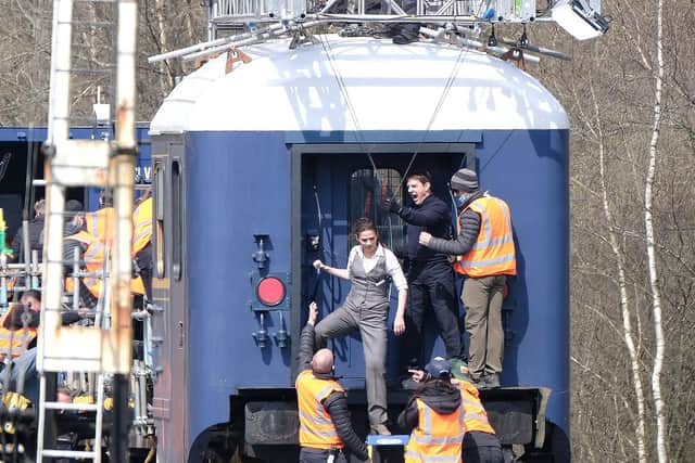 Tom Cruise filming an action sequence with co-star Hayley Atwell - Photo: Richard Ponter