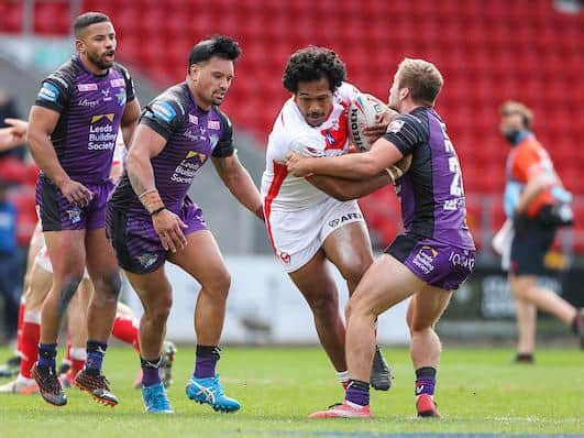 Jarrod O'Connor, right, tackles St Helens' Agnatius Paasi during this month's Cup tie. Picture by Alex Whitehead/SWpix.com.