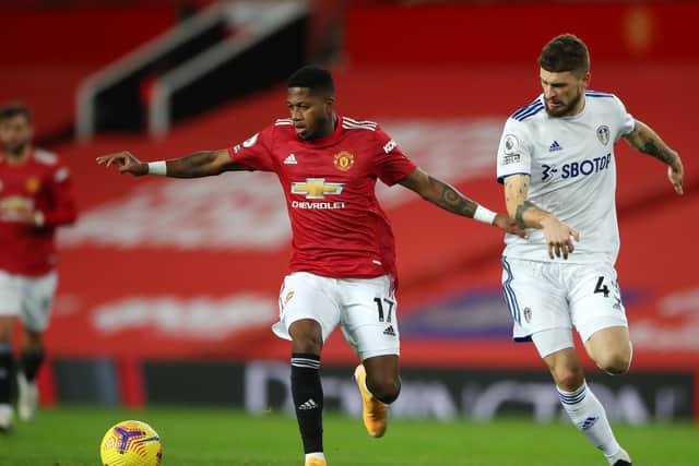 PRAISE: For Leeds United from Manchester United's Brazilian midfielder Fred, centre, pictured holding off Mateusz Klich in December's clash at Old Trafford. Photo by Nick Potts - Pool/Getty Images.