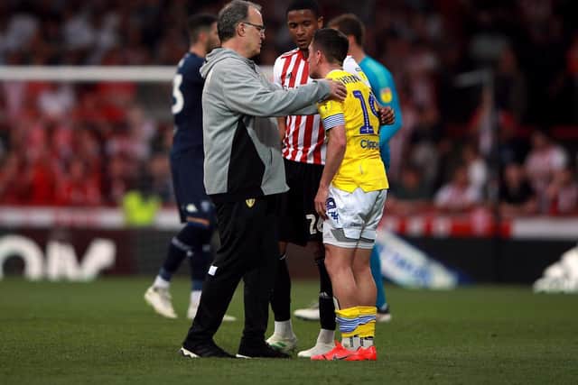 DISTRUAGHT: Leeds United playmaker Pablo Hernandez, right, is consoled by Whites head coach Marcelo Bielsa, left, after the 2-0 defeat at Brentford of Monday, April 22, 2019. Picture by Ian Walton/PA Wire.