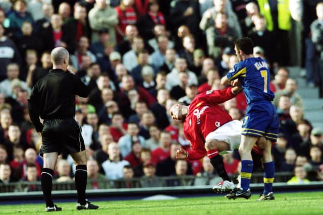 NO LOVE - Robbie Keane shoves David Beckham during a 2001 game between Leeds United and Manchester United. Pic: Getty