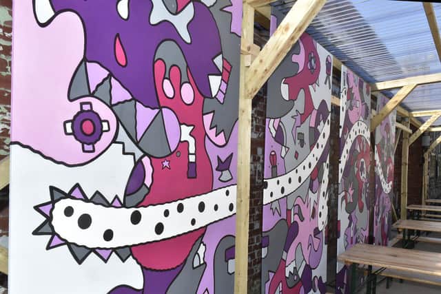 The mural is painted in Nicolas' distinctive abstract style and embodies elements of the Heart Research UK logo