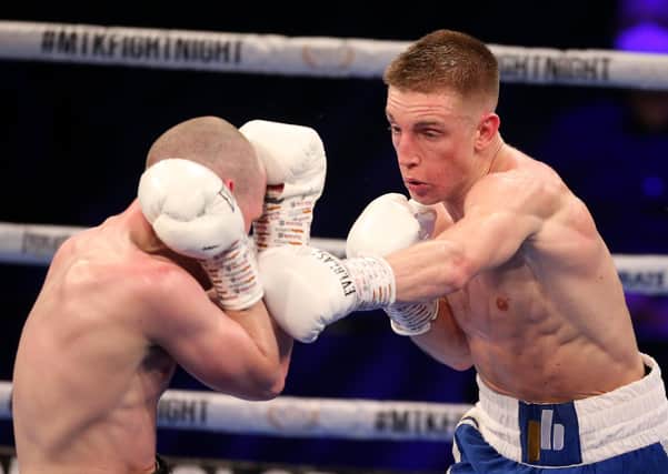 STEPPING UP: Leeds boxer Jack Bateson throws a left shot at Joe Ham during his victory at the Bolton Stadium last weekend. Picture: Lewis Storey/Getty Images.