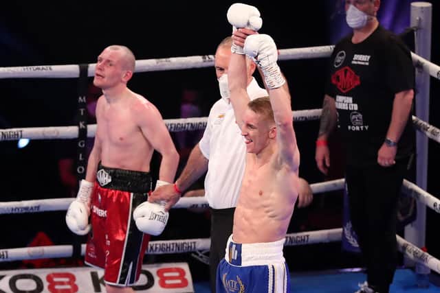 HARD FOUGHT: Jack Bateson, right, celebrates his points victory over Joe Ham. Picture: Lewis Storey/Getty Images.