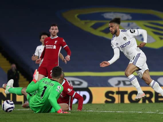 BIG STOP - Tyler Roberts, right, produced a fine save from Alisson Becker, when found by Ian Poveda, background. Pic: Getty