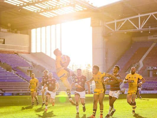 Tigers full-back Niall Evalds takes a high kick during Thursday's game. Picture by Alex Whitehead/SWpix.com.