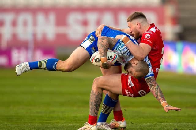 Going nowhere: Leeds winger Luke Briscoe is stopped in his tracks by Rovers' Ethan Ryan. Picture Bruce Rollinson