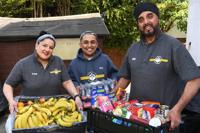 Aky and Tina Suryavansi  - who run  charity Homeless Hampers - pictured with son Akash  and donated food for homeless people.

Picture: Jonathan Gawthorpe