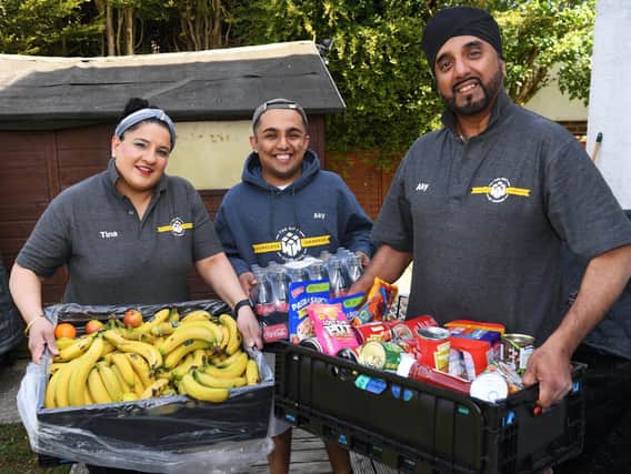 Aky and Tina Suryavansi  - who run  charity Homeless Hampers - pictured with son Akash  and donated food for homeless people.

Picture: Jonathan Gawthorpe