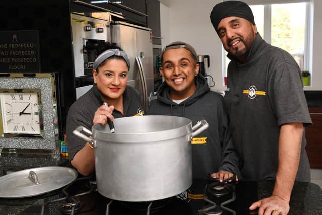 Aky and Tina Suryavansi  - who run  charity Homeless Hampers - pictured with son Akash  making a meal for homeless people.

Picture: Jonathan Gawthorpe