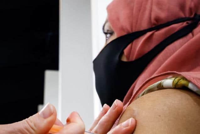 The report claims half of the NHS's pharmacy staff are involved in the vaccine rollout.
