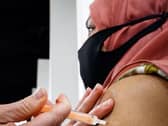 The report claims half of the NHS's pharmacy staff are involved in the vaccine rollout.