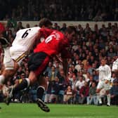 HEADING UP: David Wetherall beats Gary Pallister to the ball to net the only goal of the game in Leeds United's 1-0 victory at home to Manchester United of September 1997. Picture by Varleys.