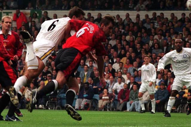 HEADING UP: David Wetherall beats Gary Pallister to the ball to net the only goal of the game in Leeds United's 1-0 victory at home to Manchester United of September 1997. Picture by Varleys.