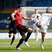 BOOKING: For Manchester United captain Harry Maguire, left, after catching Leeds United forward Tyler Roberts, right. Photo by Jon Super - Pool/Getty Images.