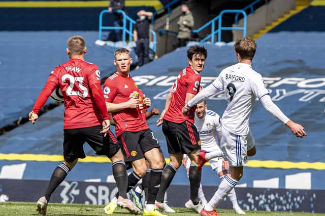 CONTENTIOUS: Manchester United survive Leeds United's claims for a penalty despite a cross from Jack Harrison, far side, being cut out by Luke Shaw's arm, left. Photo by Tony Johnson.