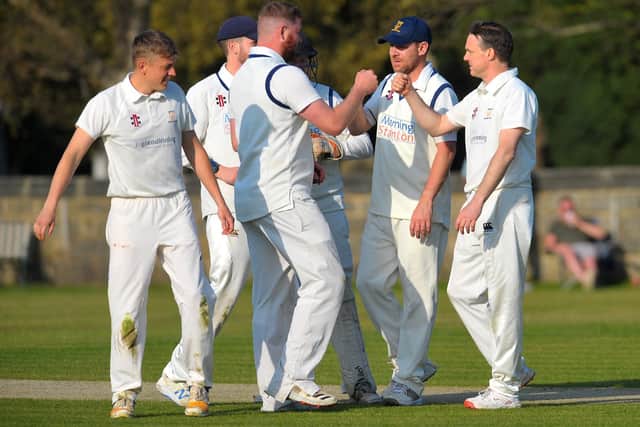 Andrew Doidge, right, of Rawdon took five wickets in his side's victory against Otley. Picture: Steve Riding.
