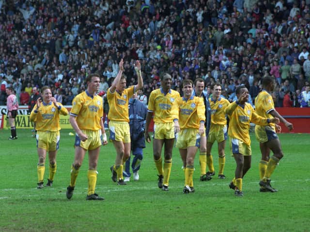 Leeds United's players celebrate at full-time with supporters at Bramall Lane. Pic: Yorkshire Evening Post