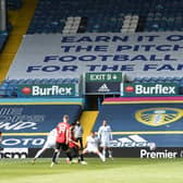 Leeds United's 'earn it' banner at Elland Road. Pic: Getty