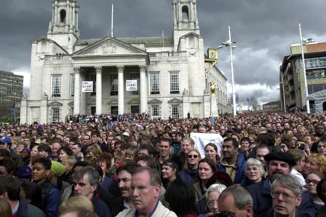 Thousands of people listen to former South African president Nelson Mandela deliver his speech at the Millennium Square in Leeds, where Mandela was made an honorary freeman during his first visit to the north of England. PA archives