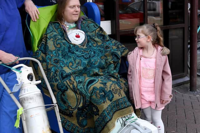 Jason Kelk has been in hospital for a year after contracting Covid. Pictured with his granddaughter Felicity Wager, 5,, during the family visit to the Lincoln Wing, St James Hospital. Picture by Simon Hulme.