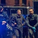 Martin Compston as Steve Arnott leads the charge at the scene of the Fleming-Pilkington shootout. PIC: BBC/World Productions/Steffan Hill