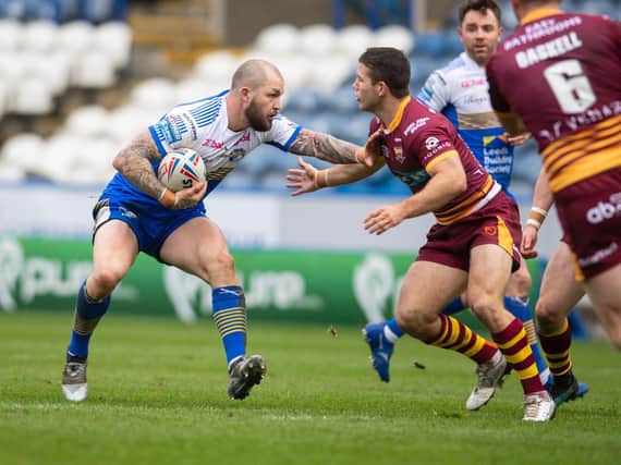 Luke Briscoe in action during Rhinos' pre-season defeat at Huddersfield. Picture by Tony Johnson.