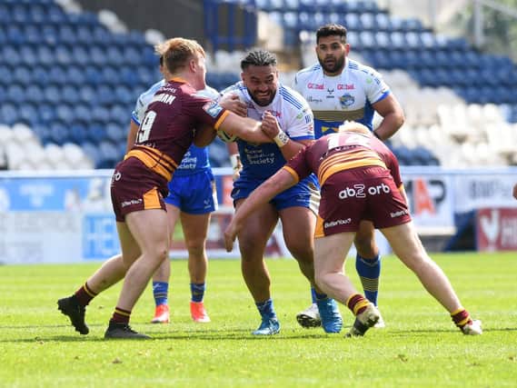 Konrad Hurrell is held by Giants' defence. Picture by Simon Hulme.