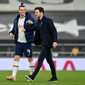 WINNING TEAM: Tottenham's interim head coach Ryan Mason, right, with hat-trick hero Gareth Bale after Sunday night's 4-0 victory at home to Sheffield United. Photo by JUSTIN SETTERFIELD/POOL/AFP via Getty Images.