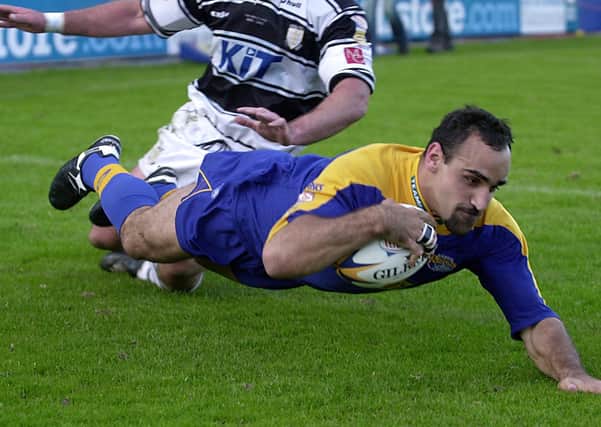Tonie Carroll diving in for a try for Leeds against Hull in May 2002. Picture: Steve Riding.