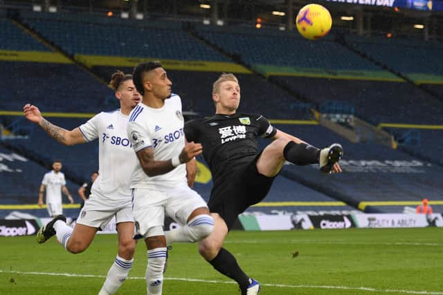 BOTH OUT: Leeds United duo Kalvin Phillips, left, and Raphinha, centre. Photo by OLI SCARFF/POOL/AFP via Getty Images.