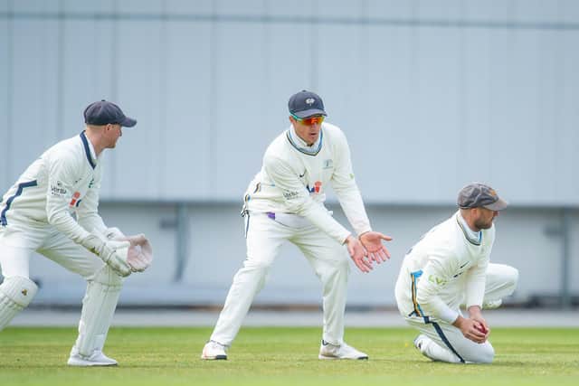 Yorkshire's Jonathan Tattersall, left, & Tom Kohler-Cadmore  look on as Adam Lyth takes a catch to dismiss Northamptonshire's Saif Zaib. Picture by Allan McKenzie/SWpix.com
