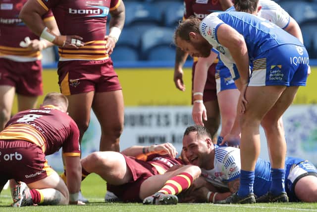 Bodene Thompson crashes over for Leeds Rhinos' opening try in the defeat at Huddersfield Giants. Picture: Richard Sellers/PA Wire.