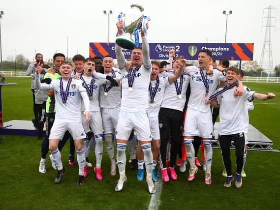 AMBITION: Outlined by Leeds United under-23s captain Charlie Cresswell, with trophy, for himself and his team mates after the conclusion of the current Premier League Two Division Two campaign. Picture by LUFC.