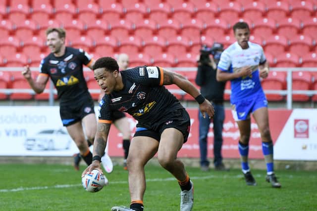 Jordan Turner scores for Tigers against Leeds. Picture by Jonathan Gawthorpe.