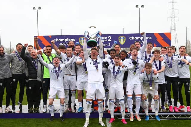 CHAMPIONS! Leeds United's under-23s captain Charlie Cresswell lifts the Premier League Two Division Two trophy at Thorp Arch. Picture by LUFC.