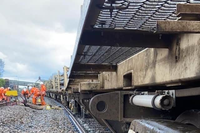 Work to recover a derailed engineering train and repair damage to the track and signalling equipment will continue overnight. Photo: Network Rail.