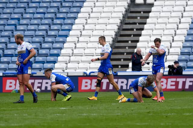 Leeds Rhinos players show their frustration after the final hooter at Huddersfield. Pcture: Simon Hulme.