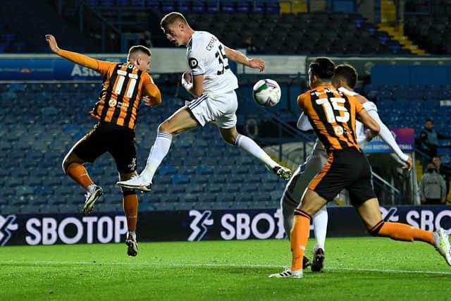 WINNING CAPTAIN - Charlie Cresswell, centre, lifted the PL 2 Division Two trophy on Monday after Leeds United Under 23s' win over Burnley. Pic: Getty