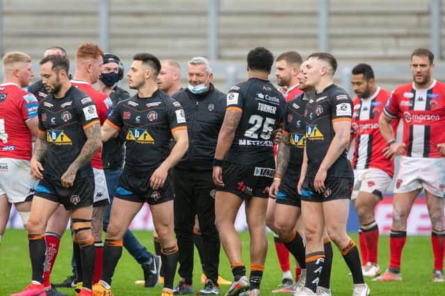 Coach Daryl Powell, centre, with his Tigers players after the dramatic win over Salford. Picture by Tony Johnson.