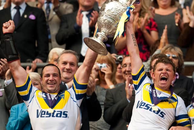 Warrington's Adrian Morley (left) and Lee Briers celebrate lifting the Carnegie Challenge Cup in 2009. Picture: Gareth Copley/PA Wire.