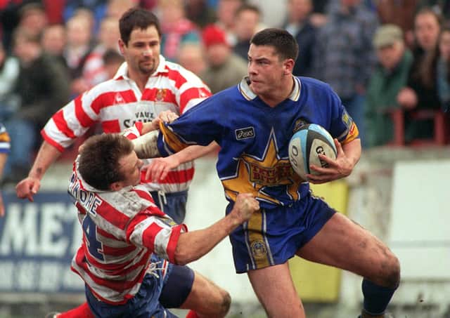 Adrian Morley fends off Andy Patmore of Oldham in 1996. Picture: Steve Riding.