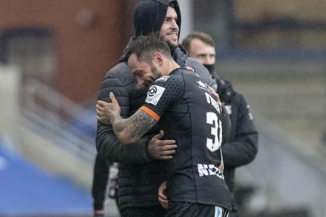 MATCH WINNER: Castleford Tigers' Gareth O'Brien is congratulated after his winning drop goal against Salford. Picture: Tony Johnson.