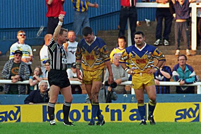 Referee Stuart Cummings shows the red card to Adrian Morley at Warrington