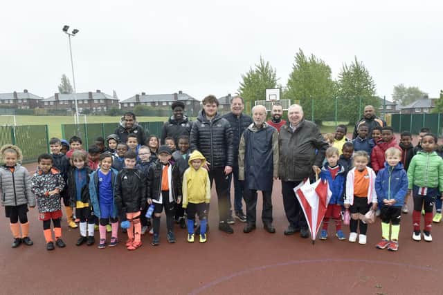 Pictured: Jake Boyd, centre left, football coach, with Freemasons Phil Fraser, Michael Rose, Alex Ullmann, Raymond Diamond from The Lodge of Dawn, Headingley, and kids from the centre. Picture: Steve Riding