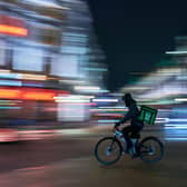 Library image of an Uber Eats delivery rider. Wendy’s will be partnering with Uber Eats to provide delivery options.