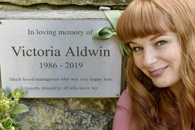 Katy Winship pictured next to a memorial plaque to her best friend Vicki Aldwin outside Chapel Allerton pub The Mustard Pot.
Photo: Steve Riding