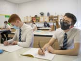 Pupils wearing masks in the classroom (photo: PA).