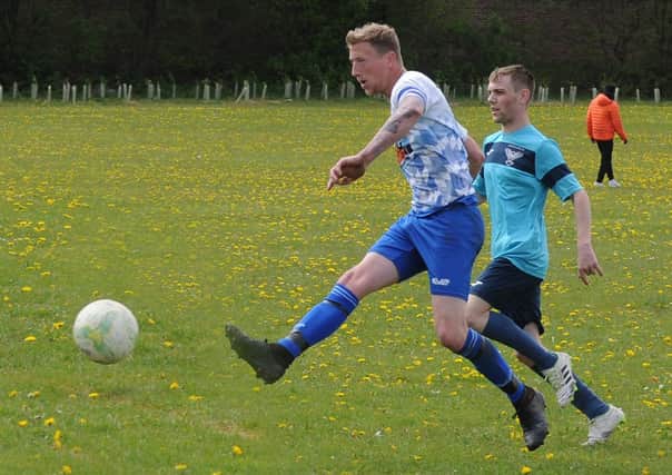 James Davies tucks away one of seven goals in Old Crooked Clock's 19-1 Leeds Combination League Division 3 win over visitors Swarcliffe FC First. Picture: Steve Riding.