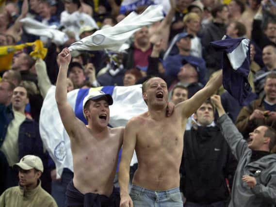 HAPPY DAYS - Leeds United fans celebrating after Dominic Matteo's goal against AC Milan at the San Siro in 2000. Whites supporters have played a huge part in his life and recovery from brain surgery. Pic: Getty